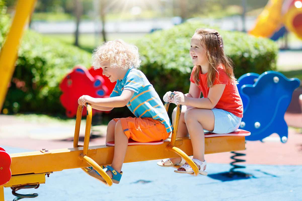 kids playing with seesaw