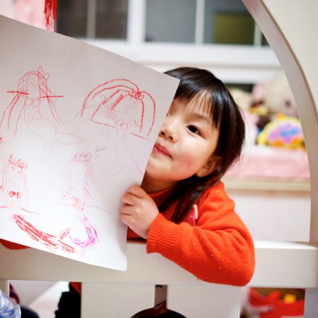 young girl with her drawing